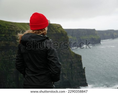 Similar – Ireland, Cliffs of Moher, woman, hiking