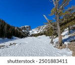 Overlooking a frozen lake on a hike in the Rocky Mountain national park 