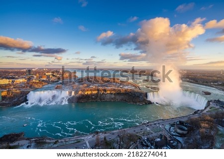 Overlooking the Niagara Falls ( American Falls and Horseshoe Falls ) in sunset time.