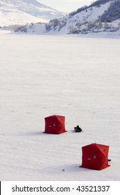 Overlooking Two Ice Fishing Tents On Frozen Lake In Utah - Pineview Reservoir