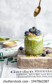 Overnight Matcha Chia Oats Are Topped With Yogurt And Blueberries. Healthy Breakfast.