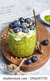 Overnight Matcha Chia Oats Are Topped With Yogurt And Blueberries. Healthy Breakfast. Close Up.