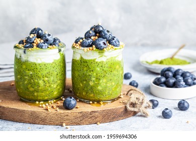 Overnight Matcha Chia Oats Are Topped With Yogurt And Blueberries. Healthy Breakfast. Close Up.