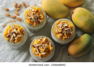 Overnight Oats With Mango And Almonds. Made By Soaking Rolled Oats And Chia Seeds In Milk Served With Chopped Mangoes, Almonds And Honey For A Chilled, Yummy, Healthy And Easy Breakfast.