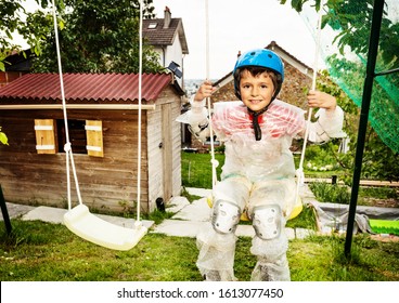 Overprotective Boy In Bubble Wrap Swing On Swings