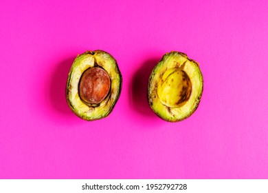 Over-ripe, Spoiled Avocado On A Pink Background.