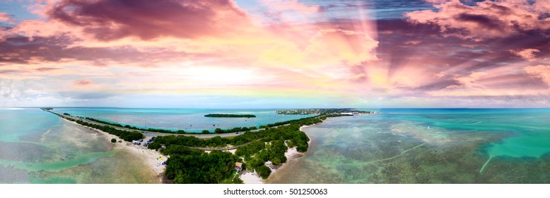 Overseas Highway and Florida Keys coastline, aerial sunset view.