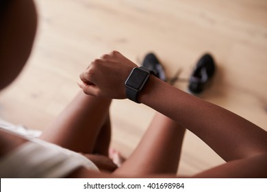 Over-shoulder View Of Young Black Woman Checking Smart Watch