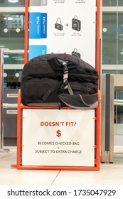 The Oversize Backpack Lying On A Control Cage For Measure Size Of Carry On Luggage. Checking Baggage Size At The Airport.