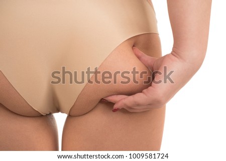 Oversize female pinching skin on her butt for test