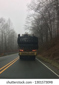 Oversized Load Of Junk Tires Traveling Through Coal Country. 