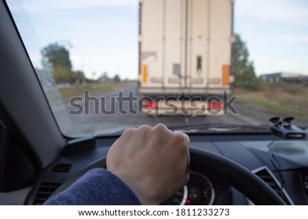 Overtaking a car . Travel by car. Dangerous maneuver.