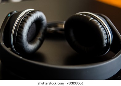 Over-the-Ear Headphones -  Close up of Big Black Headphones - Powered by Shutterstock