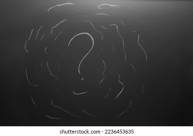 overthinking concept. Question mark drawn on chalkboard.