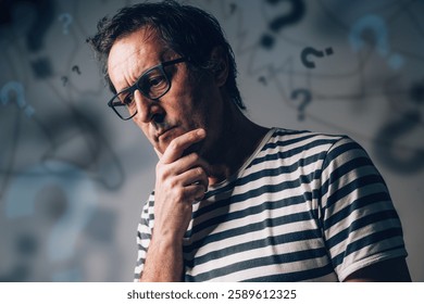 Overthinking and overanalyzing or analysis paralysis concept, perplexed anxious man, selective focus