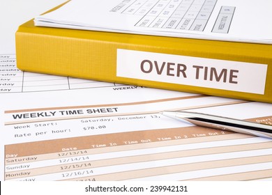 Overtime words on document binder place on blank weekly time sheets - Shutterstock ID 239942131