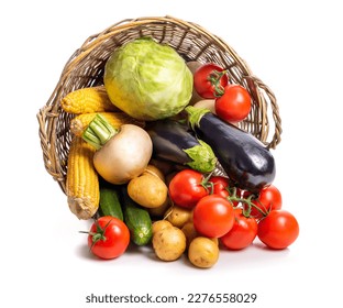 Overturned basket with vegetables Isolate on white background