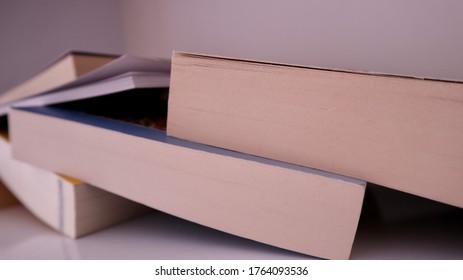 Overturned Books On The Messy Bookshelf