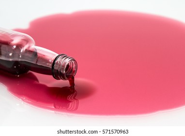 Overturned Bottle With Red Juice,big Stain.