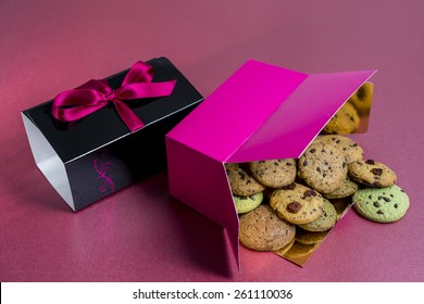 Overturned Box Of Biscuits / Chocolate Chip Cookies Spread Outside The Box / Chocolate Chip Biscuits Spread