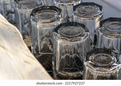 Overturned Glasses On A Wooden White Bar Counter