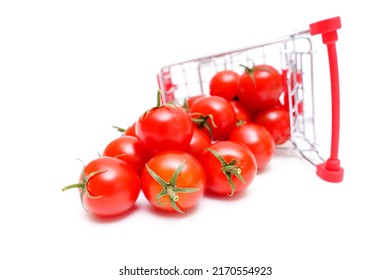 Overturned Toy Shopping Trolley With Fresh Cocktail Tomatoes Isolated On White.