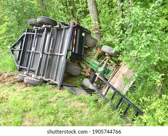 Overturned Tractor And Trailer Laying In The Ditch After An Accident