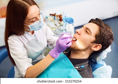 Overview of dental caries prevention. man at the dentist's chair during a dental procedure. Healthy Smile.
