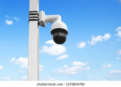 Overview Of Surveillance Cameras On A Cloudy Background. Security Concept. Face Recognition. Program For Finding Criminals. Two Outdoor Security Cameras