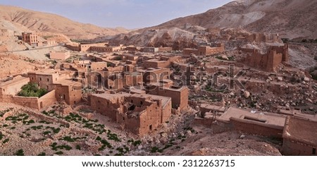 Overview of a typical Berber village in Atlas mountains, Morocco. The former caravan route. Red Berber villages, a realm of peace and nature. The photo taken before earthquake in September 2023.