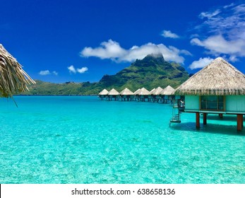 Overwater bungalows of a luxury resort providing a view on the Otemanu, Bora Bora, Tahiti, French Polynesia
