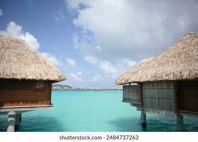 Overwater bungalows, turquoise lagoon water, Bora Bora, French Polynesia - Powered by Shutterstock