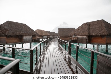 Overwater bungalows and wooden walkway over tropical turquoise water, French Polynesia
 - Powered by Shutterstock