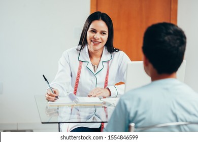 Overweight Boy Consulting With Doctor In Office