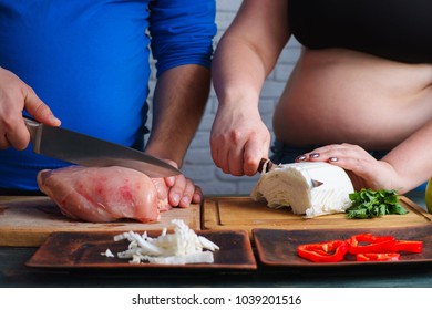 Overweight Couple Cooking Diet Food. Fat Man And Woman Preparing Low-calorie Meals. Weight Losing, Dieting And Healthy Lifestyle