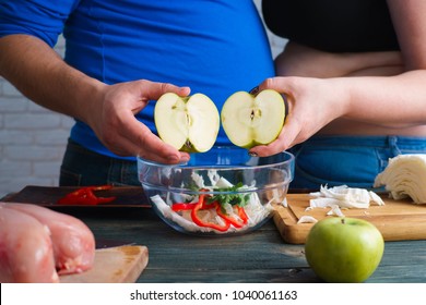 Overweight Couple Cooking Diet Food. Fat Man And Woman Eat Apple Preparing Low-calorie Meals. Weight Losing, Dieting And Healthy Lifestyle