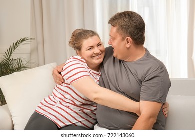 Overweight Couple At Home