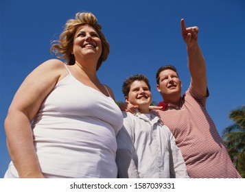 Overweight Couple With Son, Outdoors