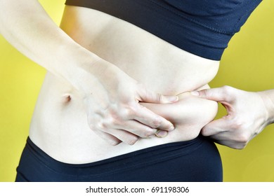 Overweight Fat Woman, Middle-aged Woman With Excessive Belly Fat, Side View Of Woman Muffin Top Waistline.