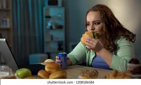 Overweight Lady Eating Unhealthy Food, Watching Show On Laptop, Sedentary Life