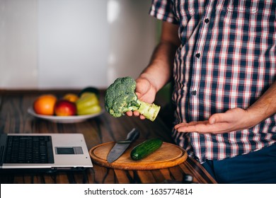 Overweight Man Recording Video Cooking Healthy Food At Home Kitchen. Cooking Recipe Online Culinary Blog, Weight Loss Support