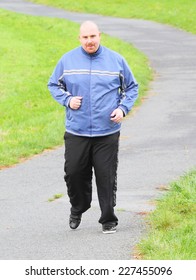Overweight man running. Weight loss concept.