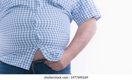 Overweight Man Trying To Fasten Too Small Clothes Isolated On White Background: Selective Focus.