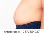 Overweight or obese man on white background. Fat mens body measurements. he is dieting and losing weight. Men at risk for diabetes Belly fat. Healthcare, medicine concept