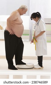 Overweight  Senior Man Measuring His Weight With Doctor