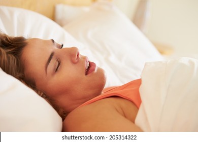 Overweight Woman Asleep In Bed Snoring