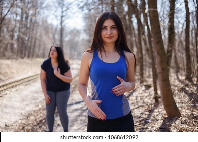 Overweight Woman Has Short Breath At Outdoor Jogging Workout. Fitness, Sports And Health Care