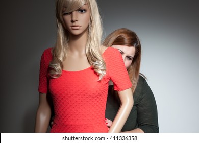 Overweight woman hidden behind mannequin - Shutterstock ID 411336358
