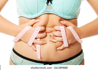 Overweight Woman Measuring Her Fat Belly.