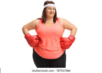 Overweight woman posing with a pair of red boxing gloves isolated on white background